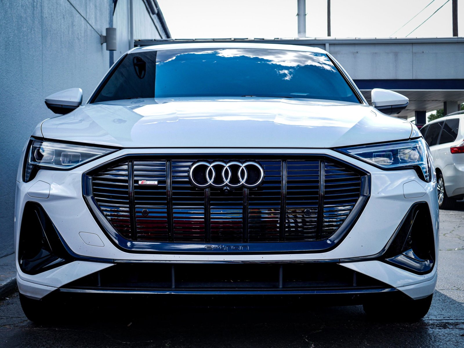 All-new 2027 Audi Q9 full-size flagship luxury SUV in Manhattan Gray featuring upright Singleframe grille and curved digital OLED lighting