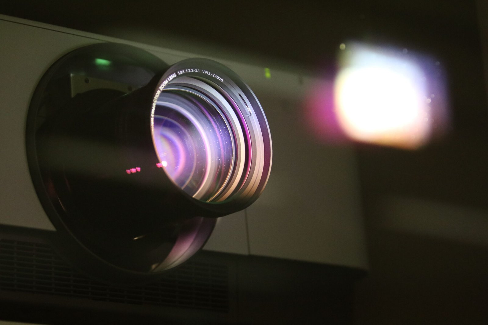 A professional media production photograph capturing a sharp cinema camera lens assembly representing how the Christopher Nolan Odyssey Morocco Algeria dispute context builds