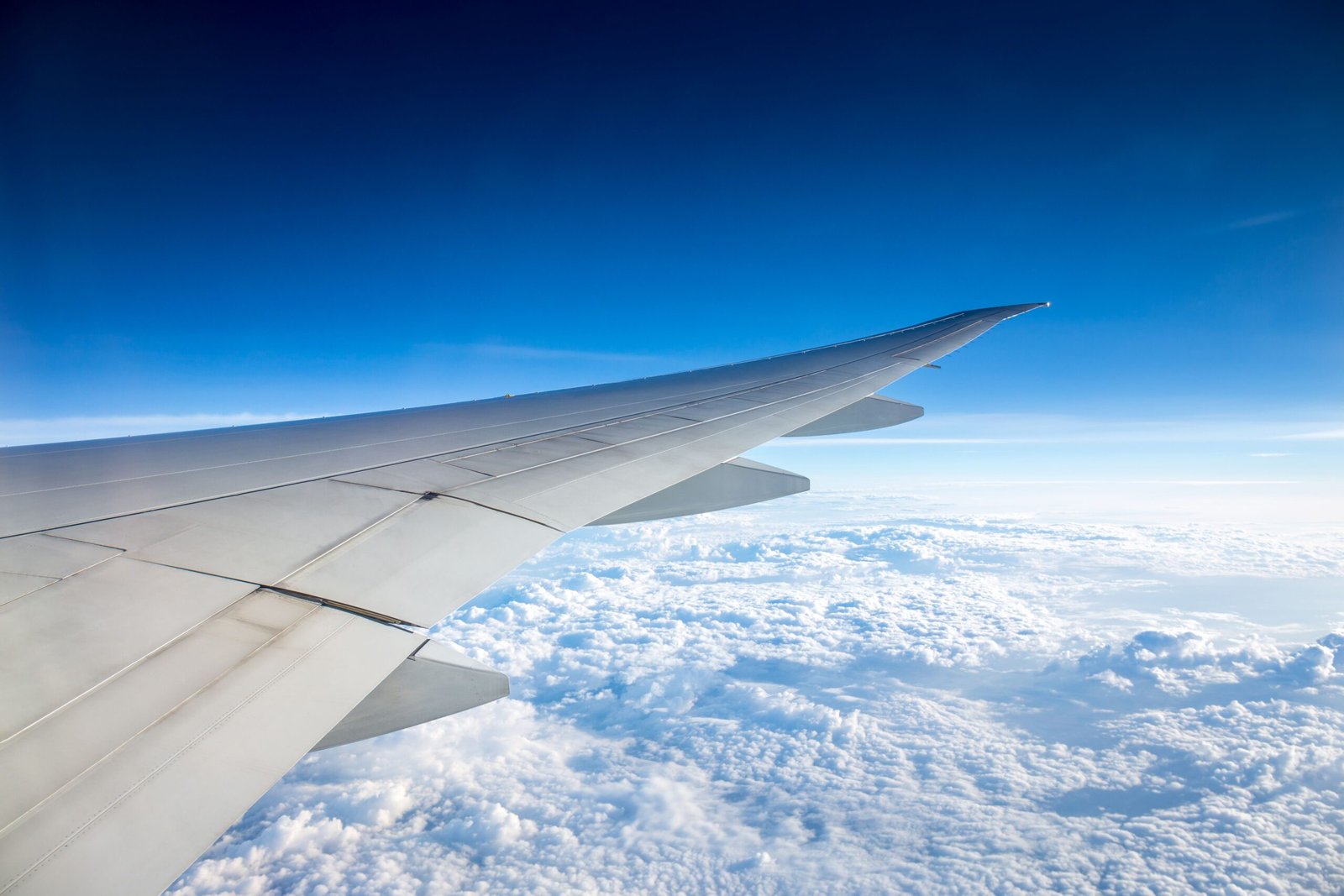 A professional commercial aviation photograph capturing aircraft aerodynamic panels representing the expansion of Embraer E-Jet E2 narrowbody aviation capaci
