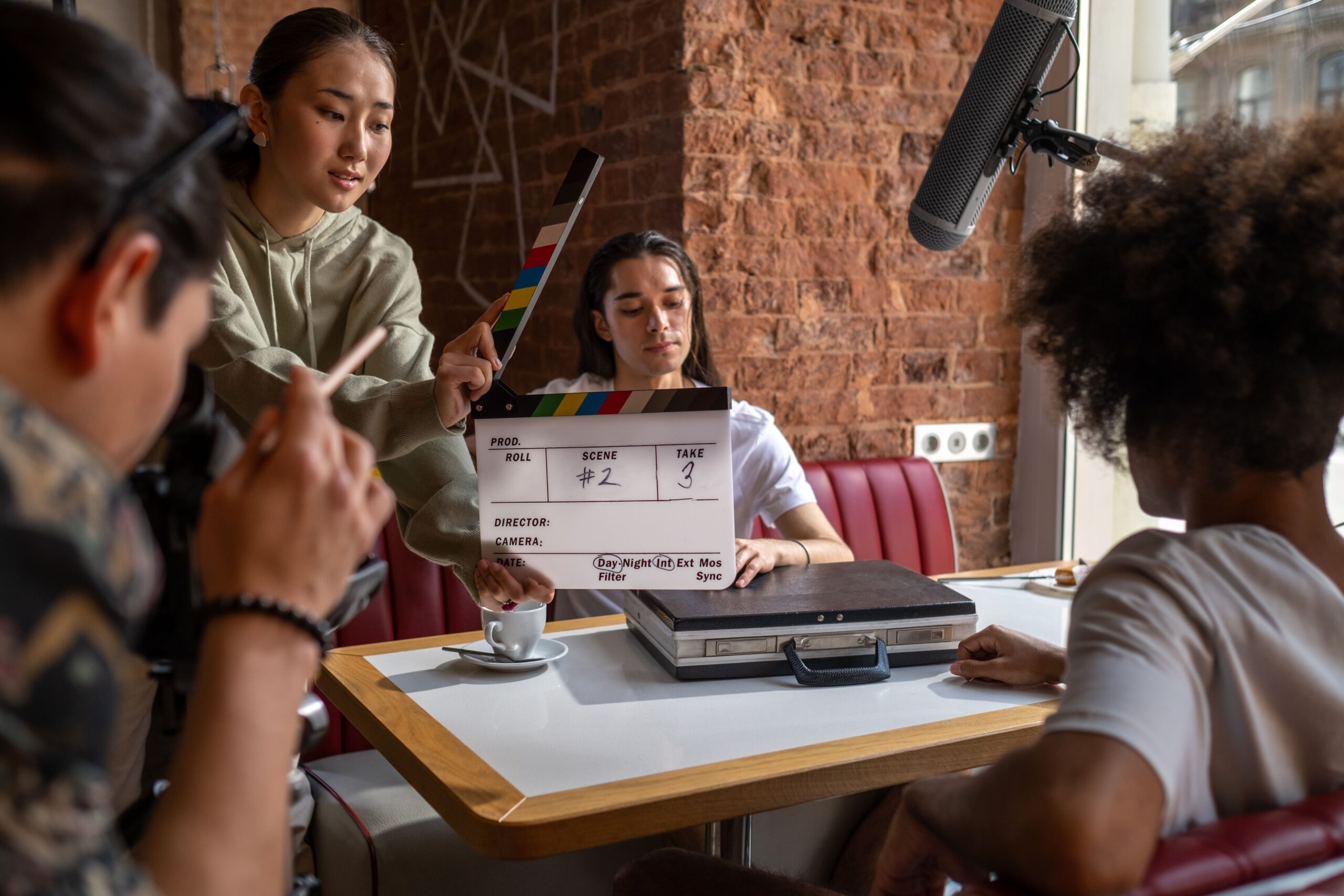 A professional movie clapperboard on a cinematic film set representing a new movie production