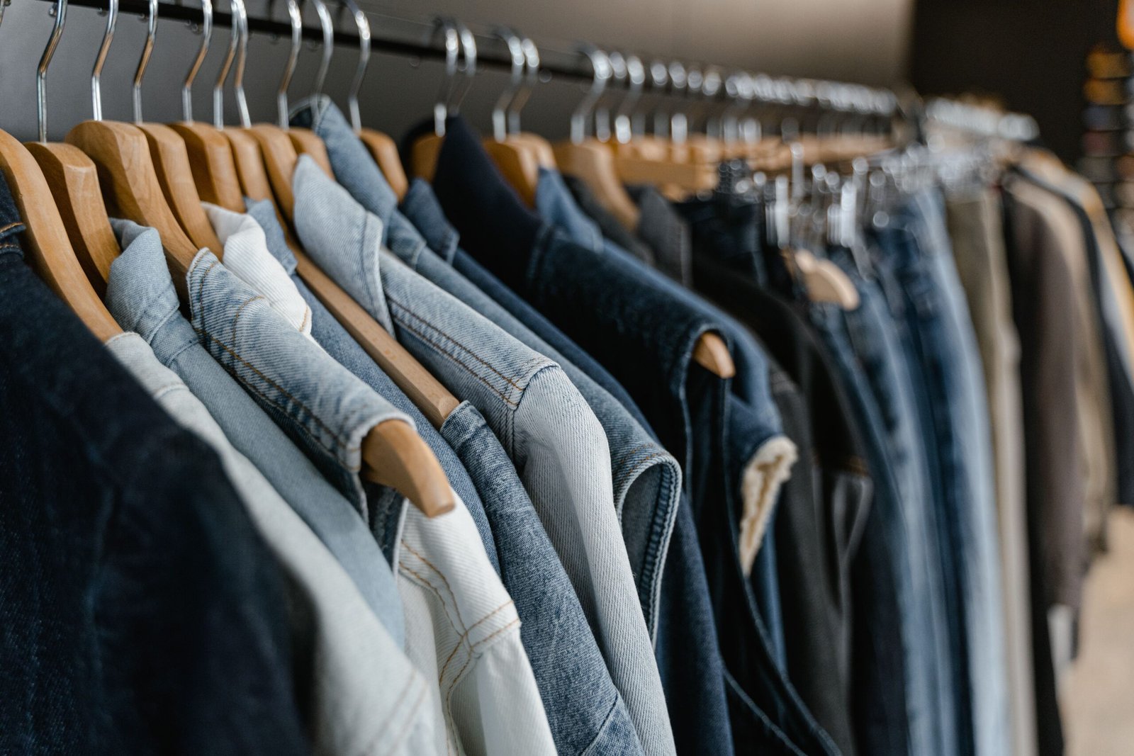 A professional commercial retail photograph capturing structured rows of apparel items representing the targets of the EU Ecodesign regulation unsold clothes destruction ban