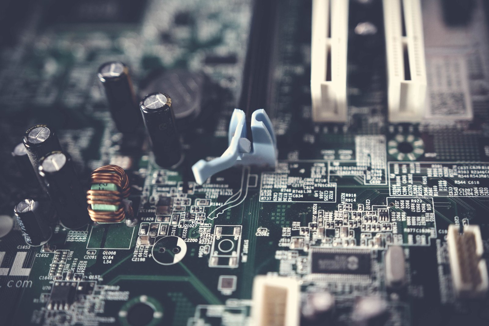 A professional editorial photography showcasing complex microchips and semiconductor circuits with blue electronic trace patterns representing Japan Russia missile technology backdoor metrics