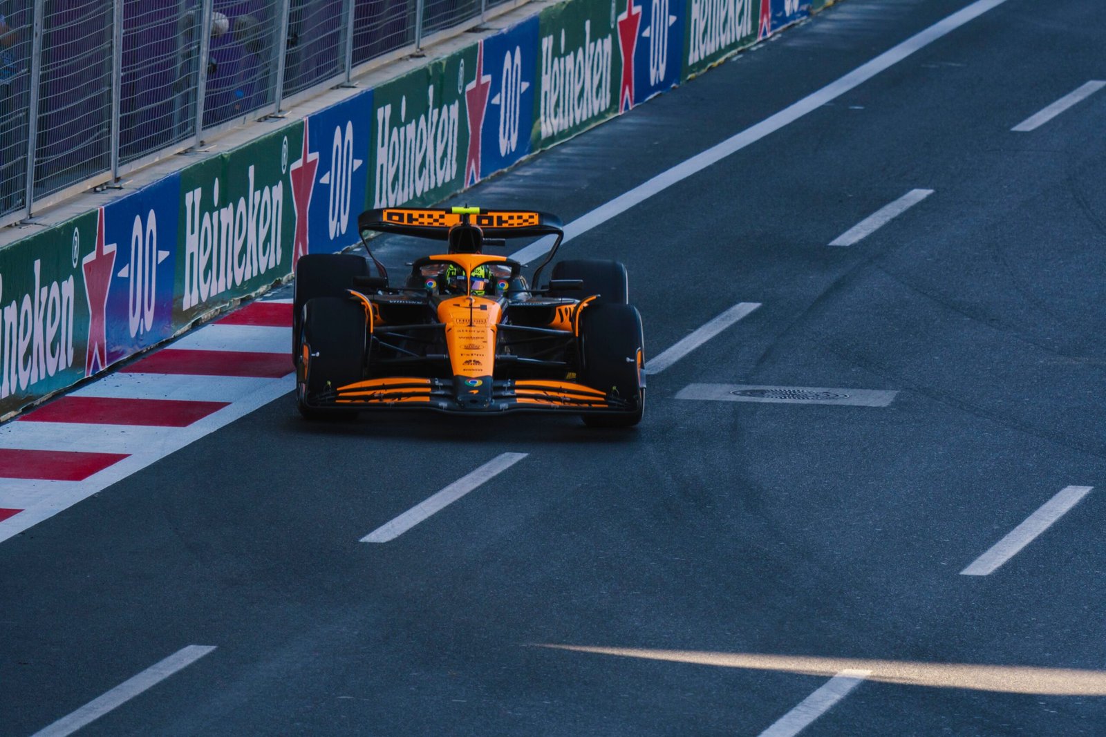 Formula 1 race car accelerating on track representing McLaren Lando Norris Hungarian Grand Prix victory