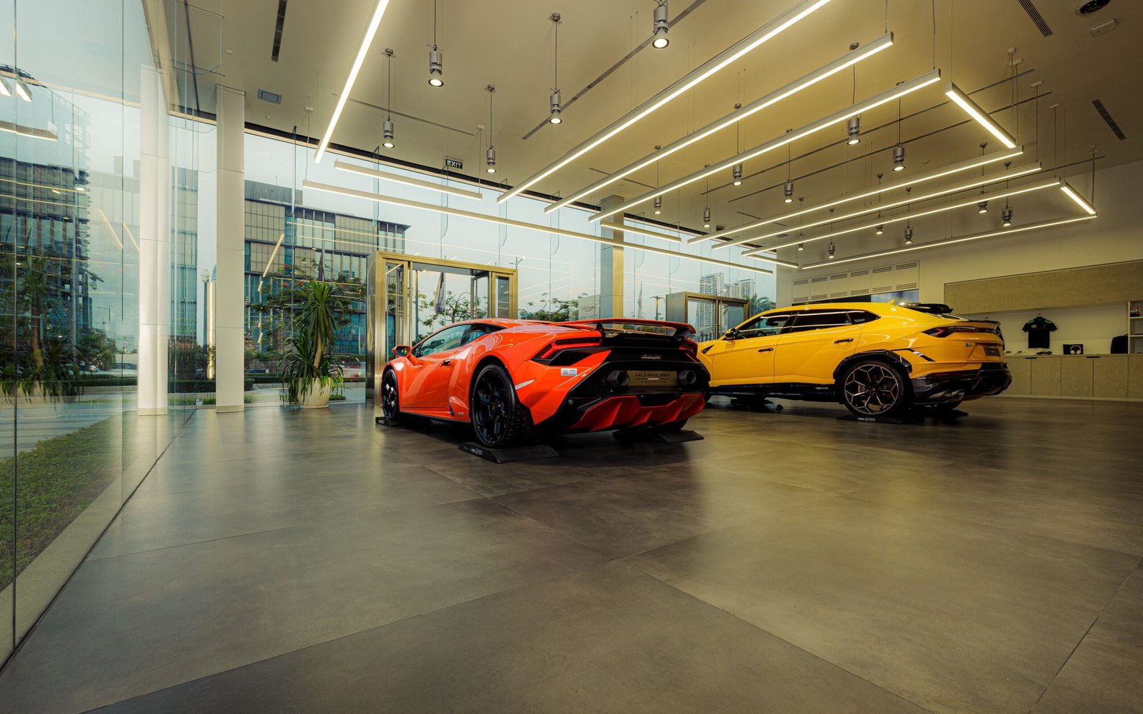 A professional commercial retail photograph capturing modern automotive showroom architectural grids representing how Lithia Motors dealership buy sell transactions execute