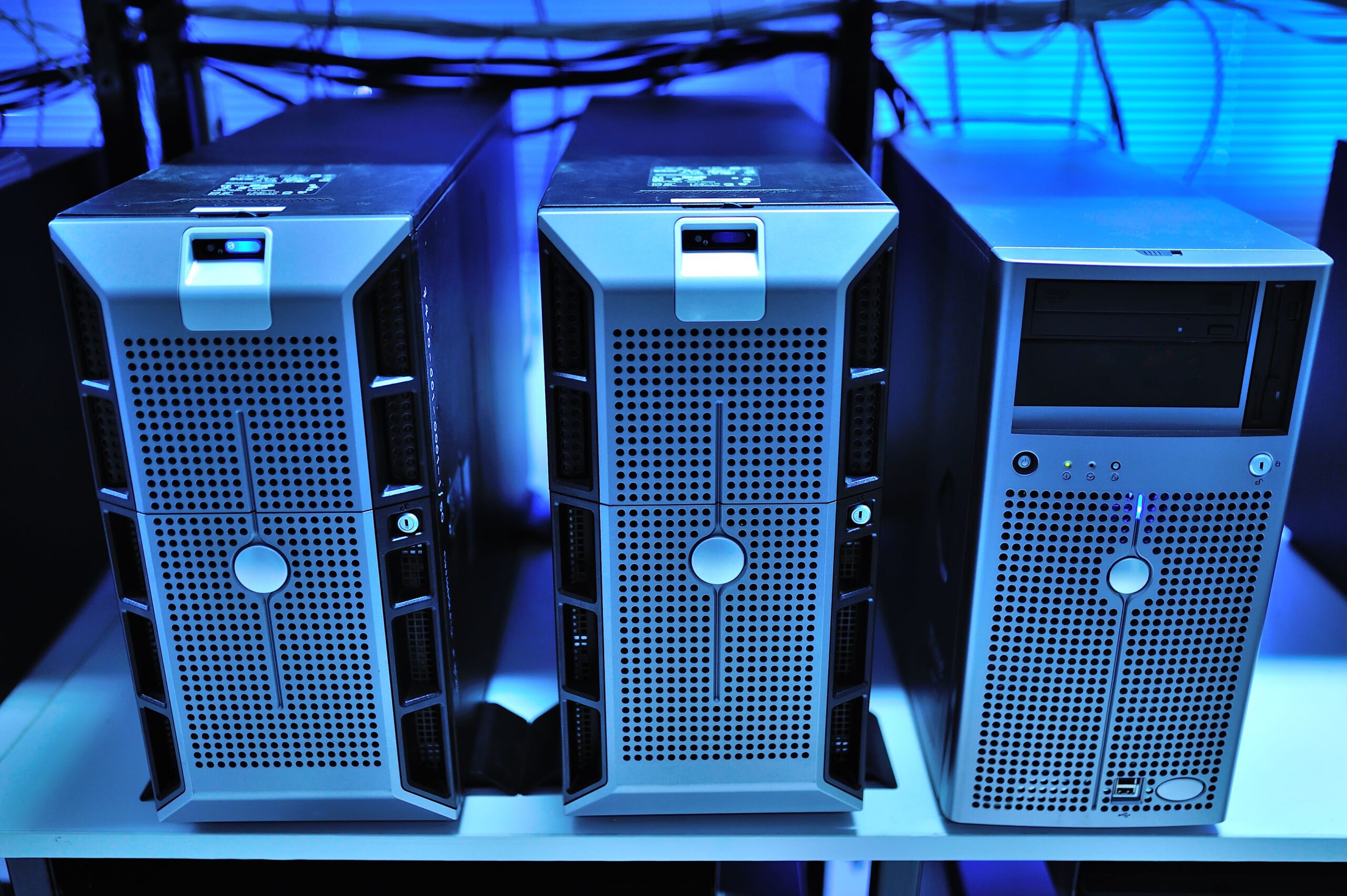 A crisp modern illustration of high-capacity digital database server towers connected directly to glowing cloud network storage graphics