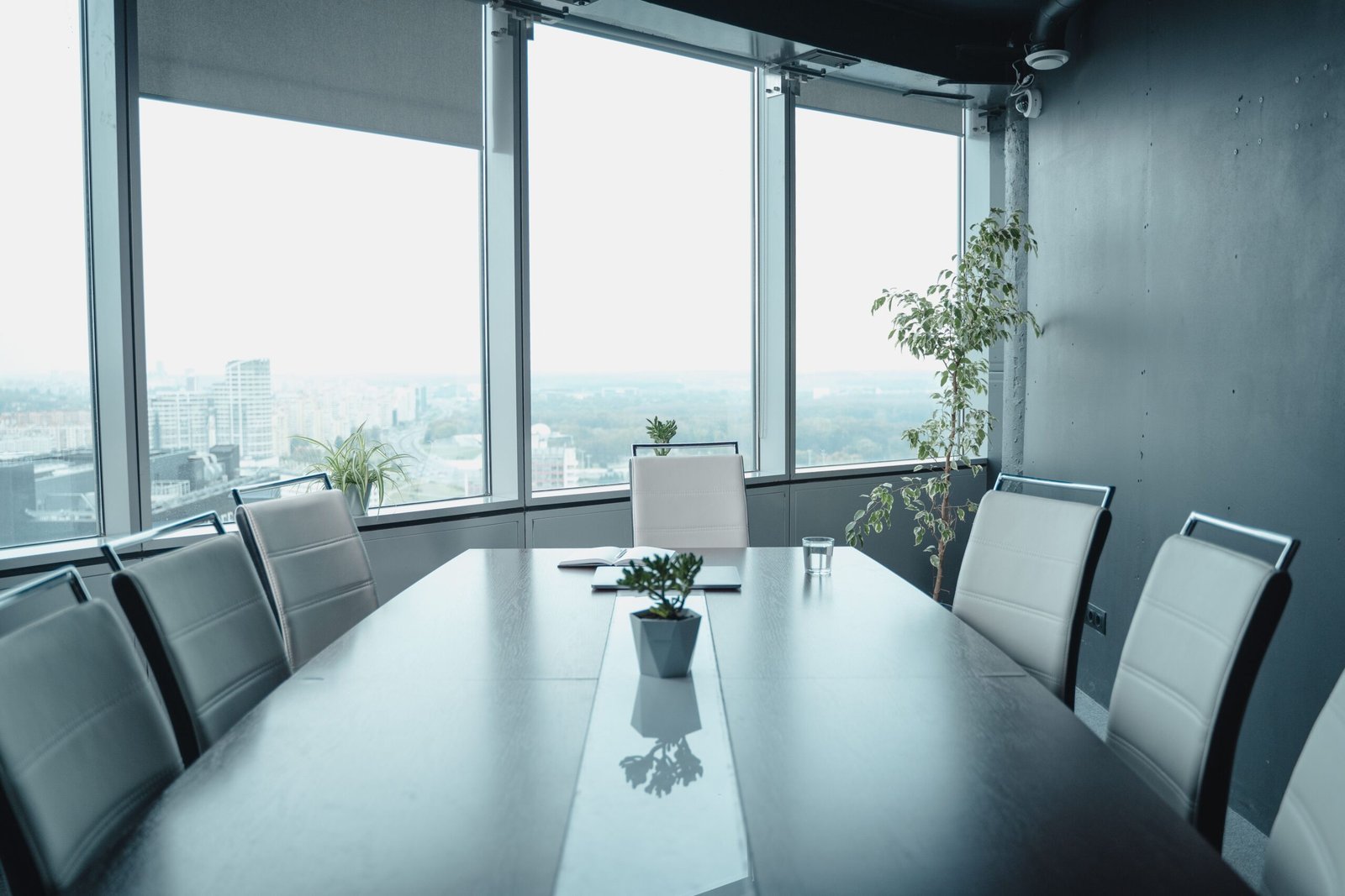 A professional enterprise technology photograph capturing geometric glass corporate structures representing how the Microsoft internal enterprise sales strategy maps compete