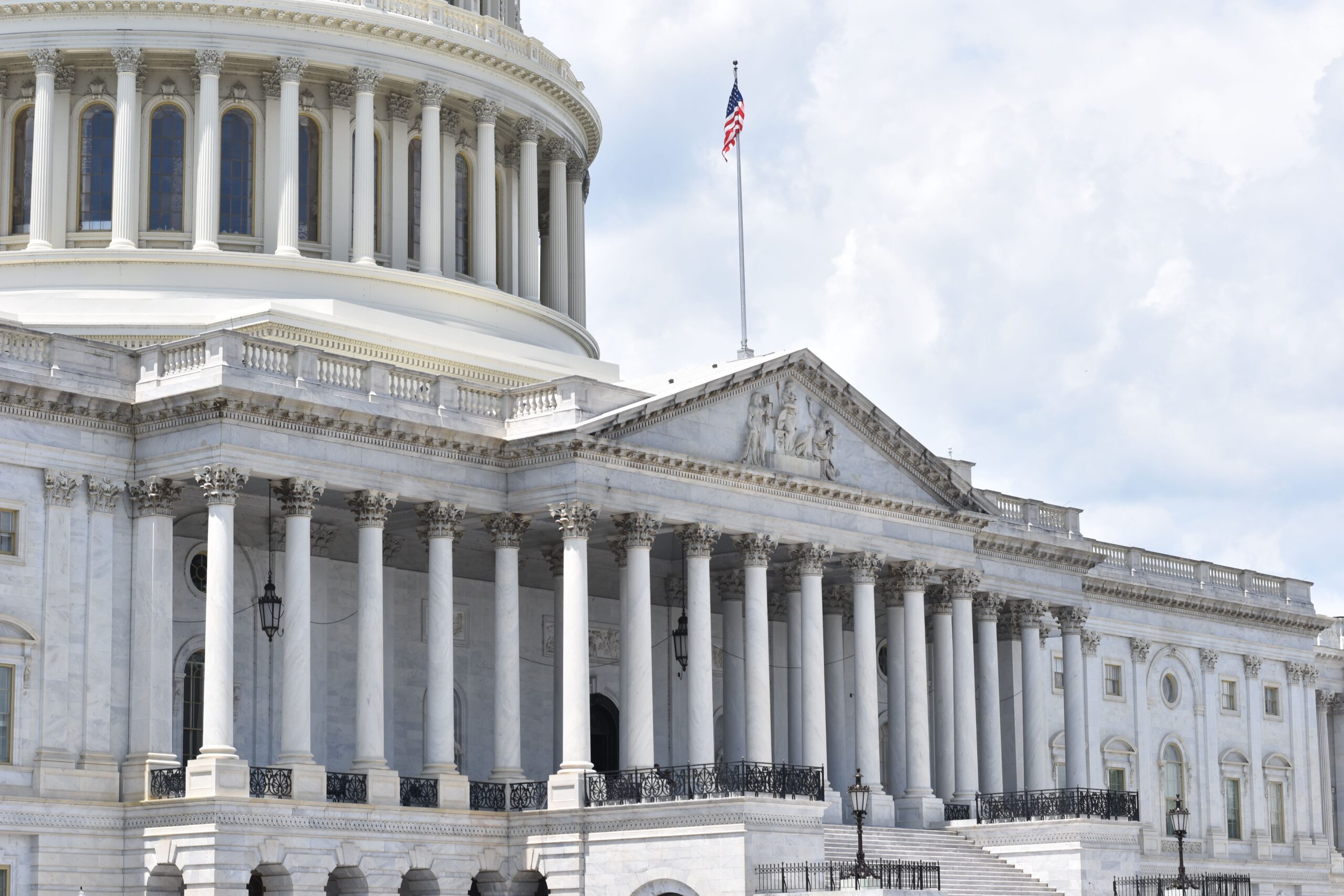 The illuminated majestic United States Capitol dome representing federal legislative leadership