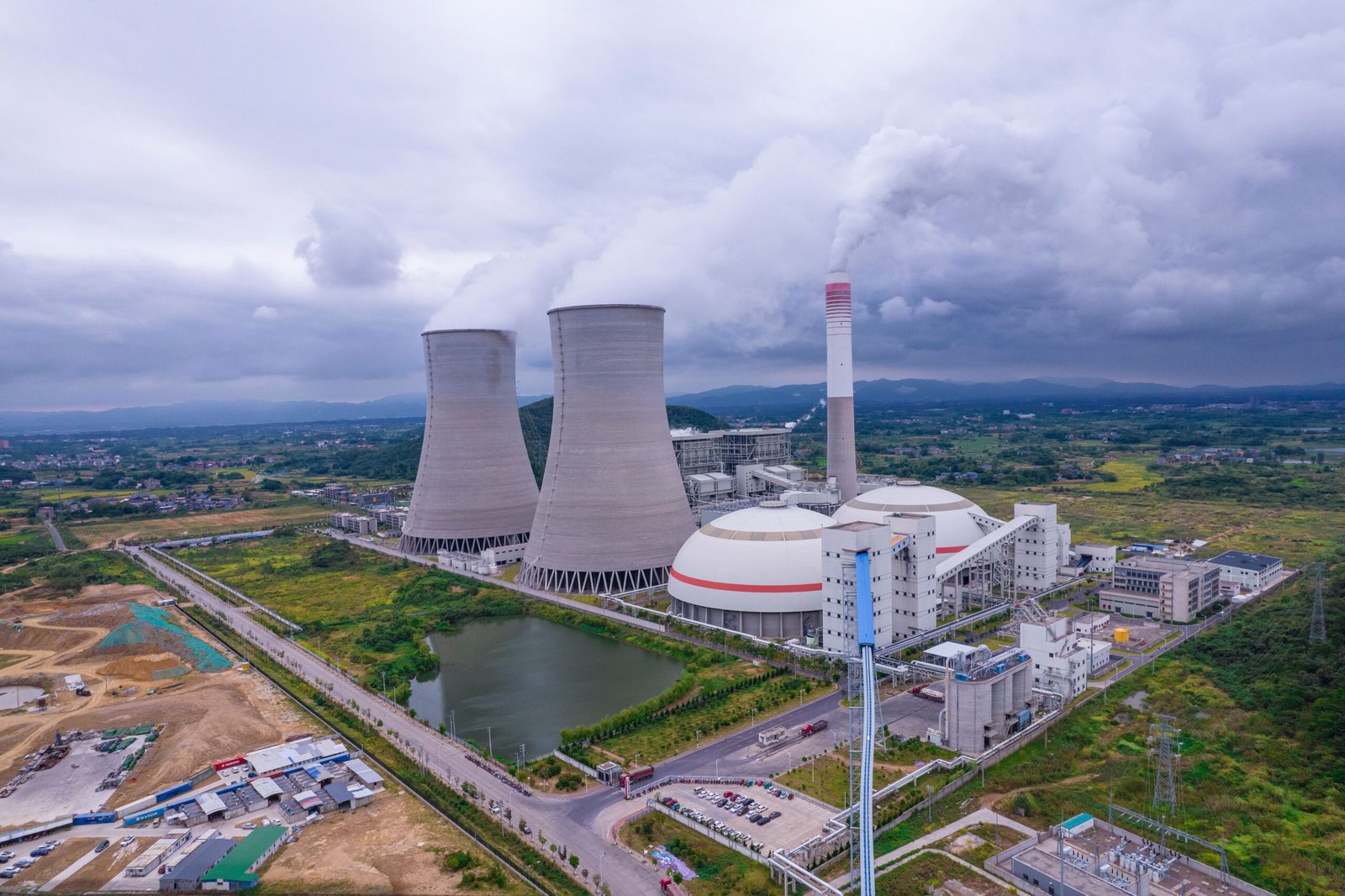 A high-tech shot of a modern clean energy power plant facility against a clear sky.