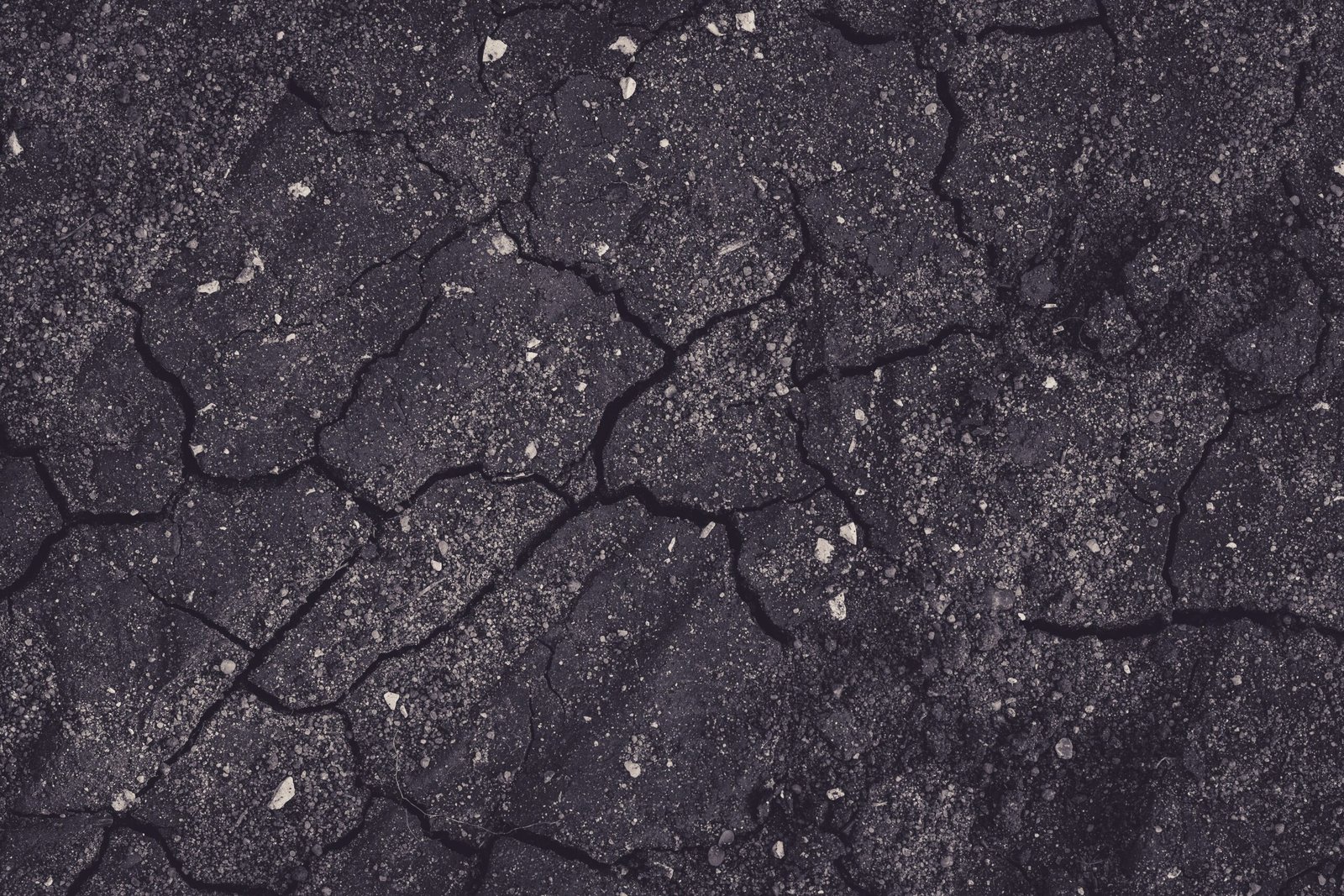 A professional abstract geological photograph capturing deep structural ground shifts representing the context where the Venezuela twin earthquake casualty impact builds